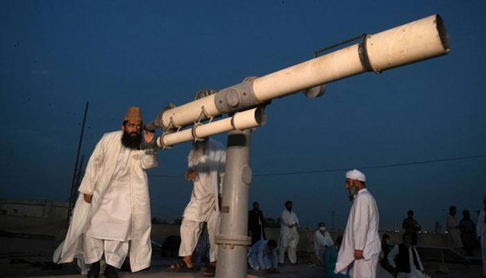 A member of the Ruet-e-Hilal Committee sighting the Ramazan moon through a telescope. - Twitter