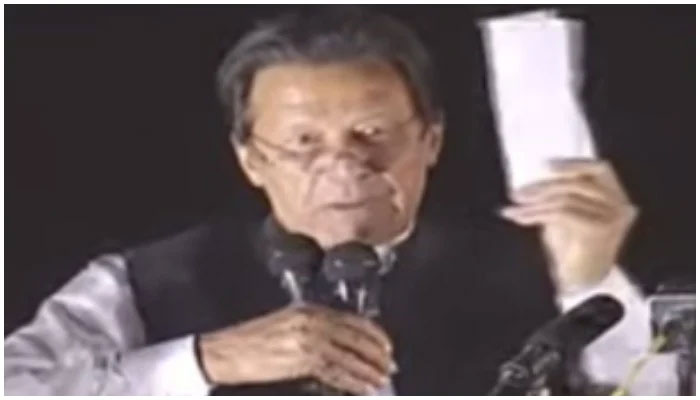 Imran Khan holding the alleged letter. Photo: Screengrab of PTIV video