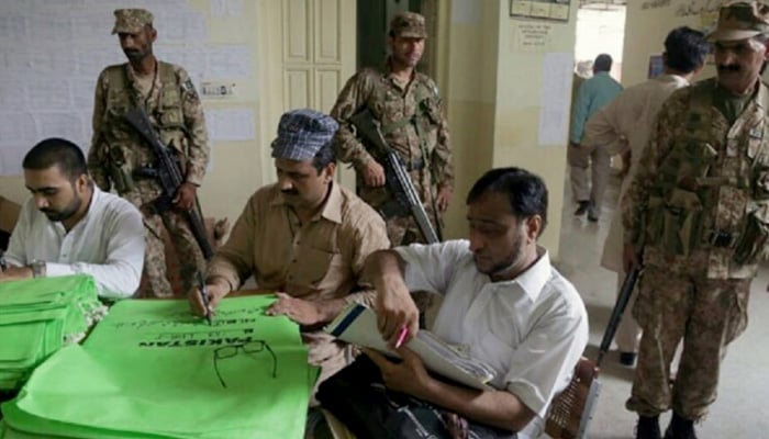 Army personnel providing security to polling staff during election. -APP/File