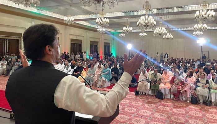 Ex-PM Imran Khan addressing the party workers and parliamentary meeting of PTI MPAs from Punjab in Lahore on July 21, 2022. Photo: INP