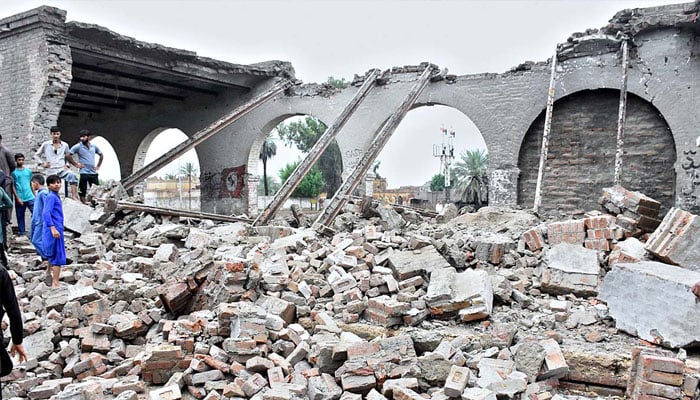 A view of damaged Railway Station Godown after heavy rain in the city, a girl died and five persons injured in this incident.— APP/ Nadeem Akhtar Soomro