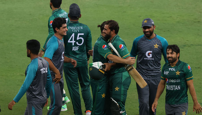 Pakistans players celebrate their win at the end of the Asia Cup Twenty20 international cricket Super Four match between India and Pakistan at the Dubai International Cricket Stadium on September 4, 2022. — AFP/ Karim Sahib