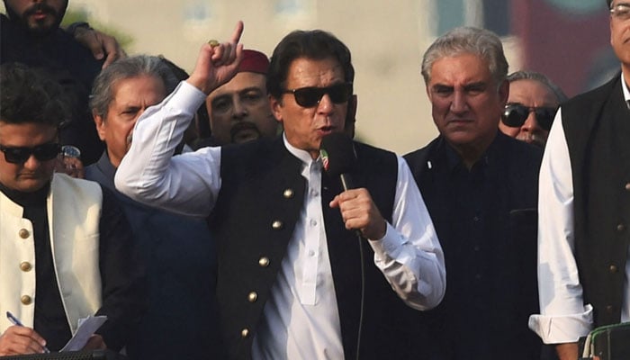 Former Pakistan prime minister Imran Khan (C) addresses his supporters during an anti-government long march towards Islamabad to demand early elections, in Lahore on October 28, 2022. —AFP/Arif Ali