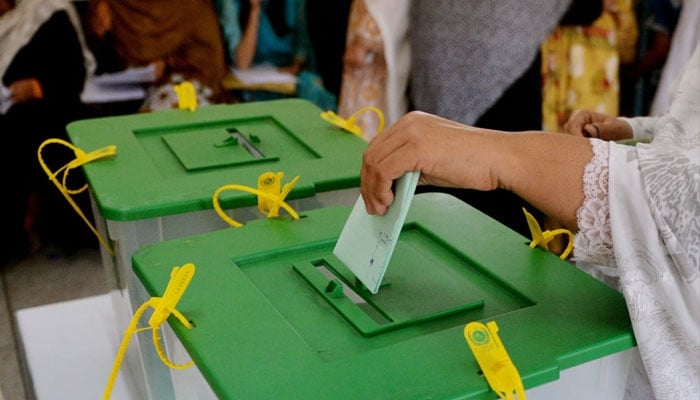 Representational image of a woman casting her vote. — AFP/File