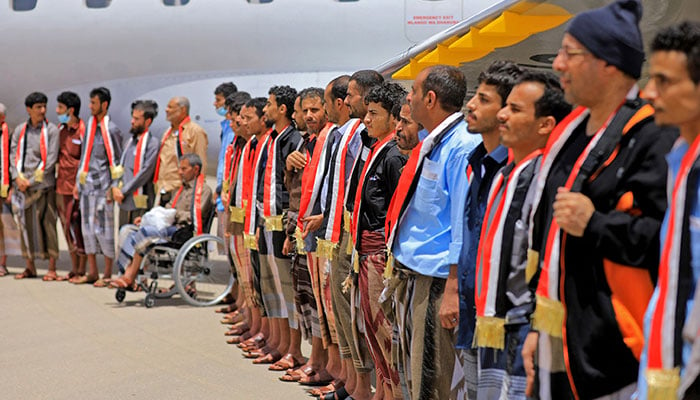 Members of Yemeni government forces who have been recently released, disembark from an aircraft upon arrival at Marib airport on April 16, 2023.