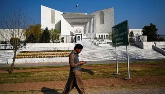 Man walks past the Supreme Court of Pakistans building in Islamabad. — AFP/File