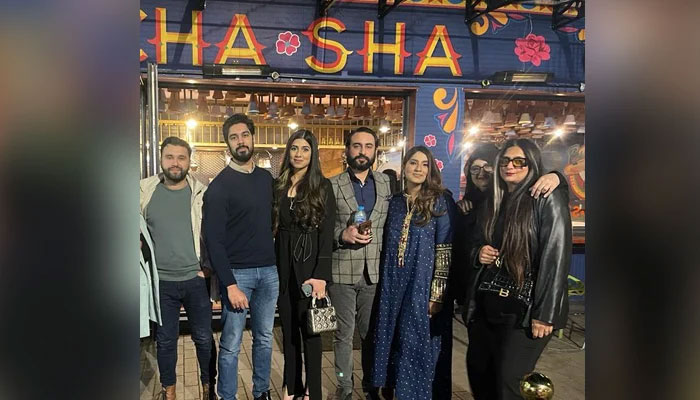 People posing outside the famous London cafe Cha Sha. — Author