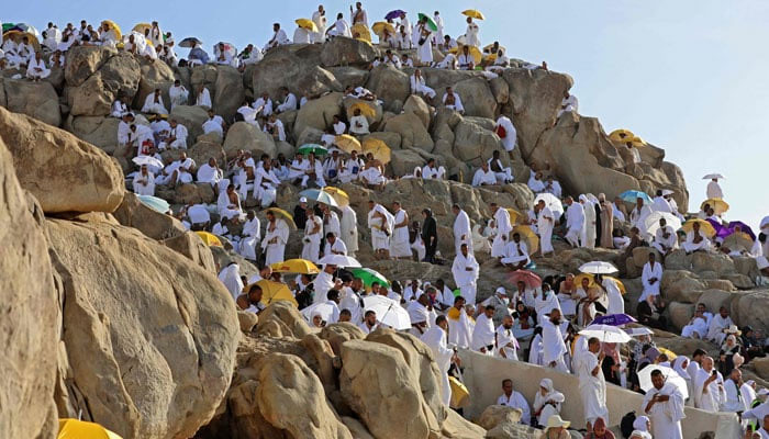 Muslim pilgrims gather atop Mount Arafat, also known as Jabal al-Rahma (Mount of Mercy), southeast of the Saudi holy city of Mecca, during the climax of the Hajj pilgrimage, on July 8, 2022. —AFP