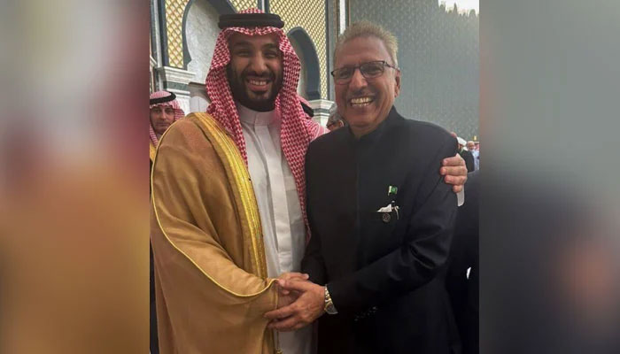 Saudi Arabia Crown Prince Mohammed bin Salman (left) and President Dr Arif Alvi shake hands with each other during a ceremony in the kingdom. — Twitter/@ArifAlvi