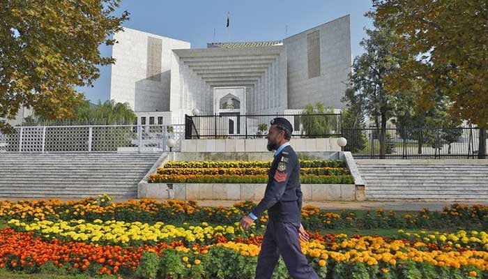 A policeman walks past the Supreme Court building in Islamabad, Pakistan. — AFP/File