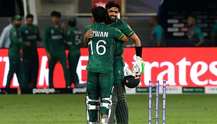 Pakistan´s captain Babar Azam (right) and his teammate Mohammad Rizwan celebrate their win in the ICC Twenty20 World Cup cricket match between India and Pakistan at the Dubai International Cricket Stadium in Dubai on October 24, 2021. — AFP