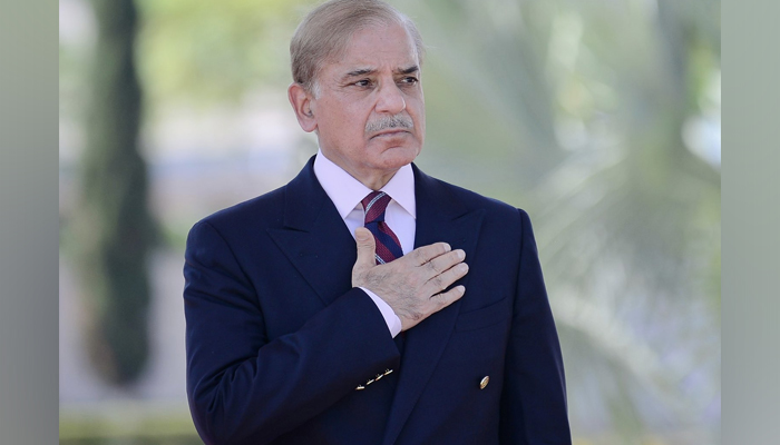 Former prime minister Shehbaz Sharif stands in reverence after the dissolution of the national assembly in Prime Minister Office Islamabad on August 10, 2023. — Twitter/@CMShehbaz