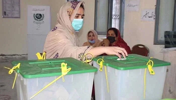 A woman casts her vote at a polling station during the NA-75 Sialkot-IV Daska by-election on April 10. — APP