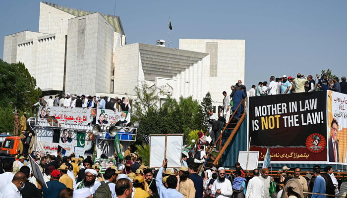 Supporters of parties from Pakistans ruling alliance gather near the Supreme Court in Islamabad on May 15, 2023. — AFP