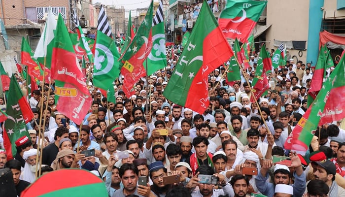 Pakistan Tehreek-e-Insaf (PTI) workers while in a rally in KPK. — Facebook/PTI