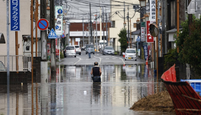 A man can be seen walking as flooding from heavy rains submerged several areas in Mobara, Chiba Prefecture, in Japan on Friday 09, September, 2023. — Kydo news agency