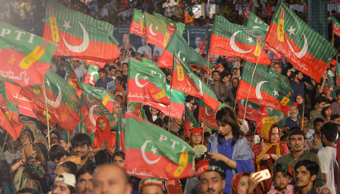 Supporters of Pakistan Prime Minister Imran Khan attend an election campaign rally ahead of the general election in Karachi. — AFP/File