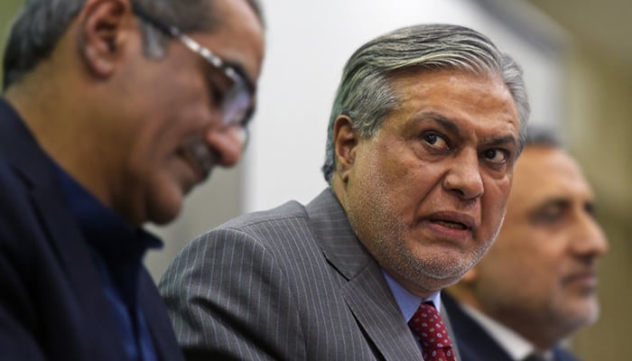 Former Finance Minister Ishaq Dar speaks at a press conference in Islamabad. — AFP/File