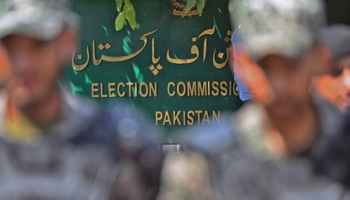 Paramilitary soldiers stand guard outside Pakistan’s election commission building in Islamabad on August 2. — AFP