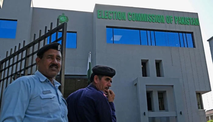 Security personnel stand guard at the headquarters of the Election Commission of Pakistan in Islamabad on September 21, 2023. — AFP