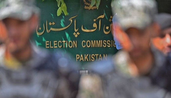 Paramilitary soldiers stand guard outside Pakistan’s election commission building in Islamabad on August 2. — AFP