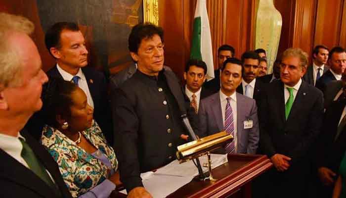 Texan-Pakistani businessman Muhammad Tahir Javed stands on former prime minister Imran Khans left side as the latter speaks during his US visit. — file picture courtesy reporter