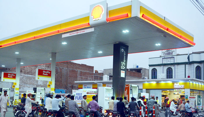 A view of a petrol pump with bikers waiting at the fuel station. — Online/File