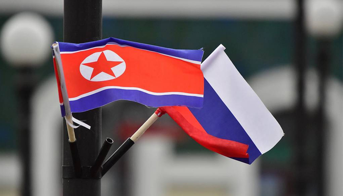 North Korean (left) and Russian flags can be seen in this picture. — TASS/File