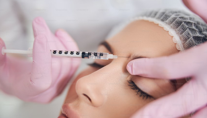 A representational image of a woman being injected with a drug in an eye treatment. — Unsplash/File