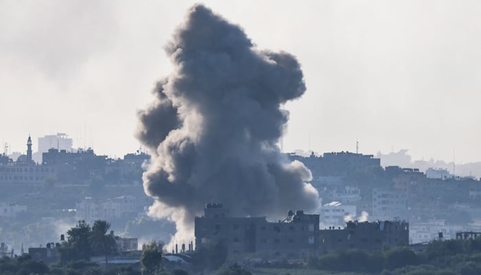 This picture taken from Israels southern city of Sderot shows smoke billowing over the northern Gaza Strip during Israeli bombardment on October 18, 2023. — AFP