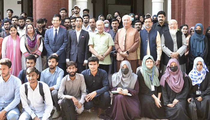 Students and senior faculty members along with Punjab University VC Prof. Dr. Khalid Mahmood (c) during the scholarship distribution ceremony in Lahore on October 19, 2023. — Facebook/University of the Punjab