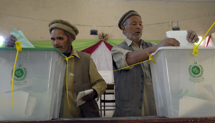 Hazara community members cast their votes at a polling station in Quetta. — AFP/File