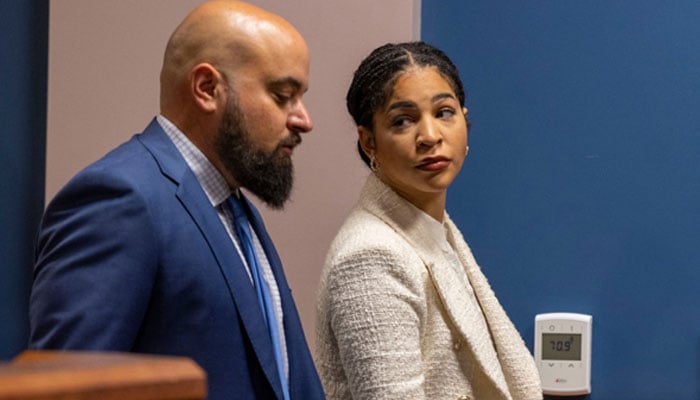 Attorneys Scott Grubman and Serreen Meki, both representing Kenneth Chesebro, talk amongst themselves in the courtroom of Fulton Superior Court Judge Scott McAfee at the Fulton County Courthouse, October 20, 2023 in Atlanta, Georgia. AFP