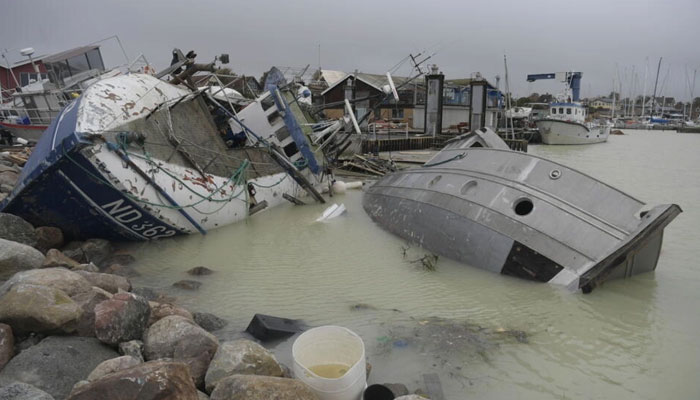 Fishing boats were left stranded or about to sink in the town of Rodvig. AFP