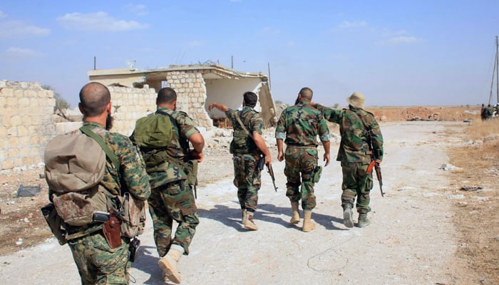 Syrian army soldiers during a patrol in a conflict-stricken area. — AFP/File