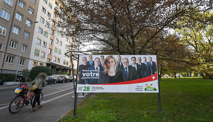 An electoral poster of candidates of the Swiss Peoples Party (SVP UDC) in Aarberg, canton of Bern. — AFP