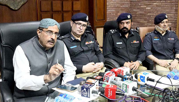 Caretaker Home Minister Sindh Brigadier (Rtd) Haris Nawaz speaking to the media at the SSP Office along with IG Sindh Police Rif­fat Mukhtar Raja on September 19, 2203. — APP.