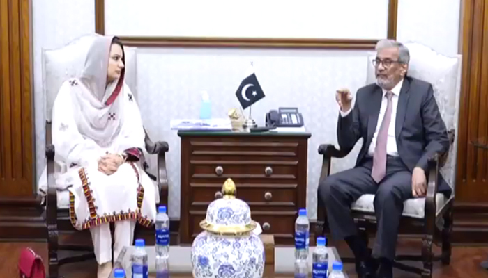 Sindh caretaker chief minister Justice (retd) Maqbool Baqar gesturing during a meeting with Balochistan interim CM’s adviser for social welfare and special education, Shania Khan at CM House on October 23, 2023, in this still. — X/@SindhCMHouse