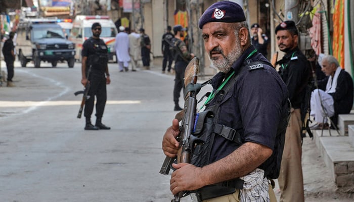 Peshawar police while standing guard in the city. — AFP/File