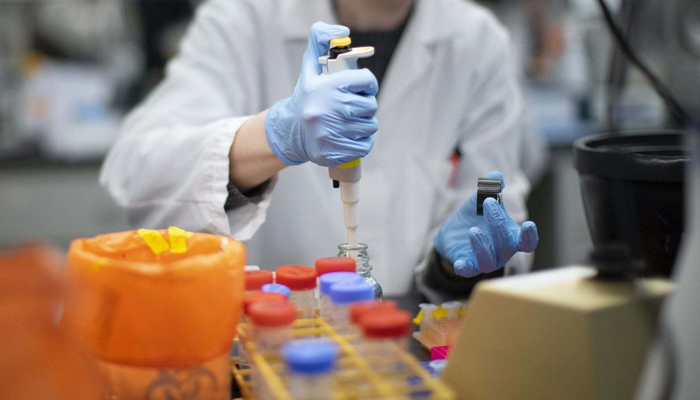 An expert is seen working in a lab. — AFP/File