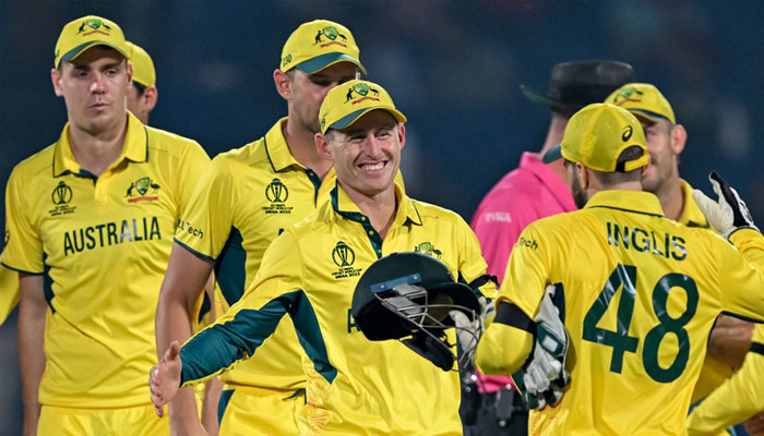 Australias players celebrate after winning their Cricket World Cup match against the Netherlands at the Arun Jaitley Stadium in New Delhi on Wednesday. — AFP