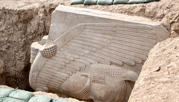 This 2,700 year old relief uncovered by archaeologists in northern Iraq depicts a lamassu, an Assyrian deity portrayed with a human head, the body of a bull and the wings of a bird. AFP