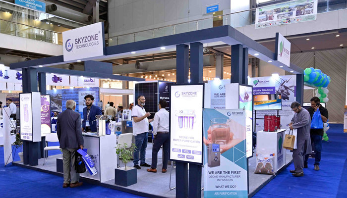 People stand on a stall during the 7th Water and Energy Exhibition in Lahore on October 26, 2023. — Facebook/Pak Water Expo