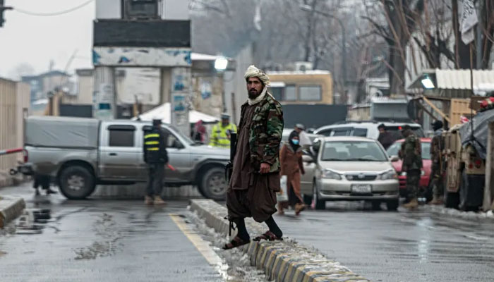 A Taliban soldier stands guard near Afghanistans foreign ministry in Kabul. — AFP/File