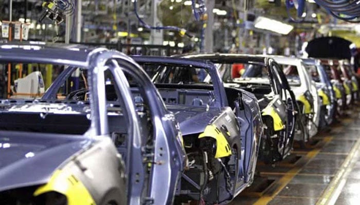 Partly finished vehicles are seen at a manufacturing plant in this undated file photo. — APP