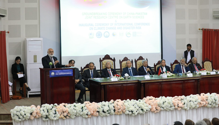 Panelists can be seen sitting on a stage with the VC Dr Niaz Ahmad Akhtar speaking with the audience during the three-day international conference on Climate Change and Disaster Risk, in this picture released on October 26, 2023. — Facebook/Quaid-i-Azam University,Islamabad