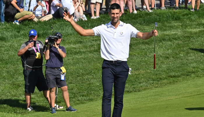 Serbian tennis player Novak Djokovic acknowledges the applause from the spectators as he walks to the 18th green during the All-Star match played ahead of the 44th Ryder Cup at the Marco Simone Golf and Country Club in Rome on September 27, 2023. — AFP