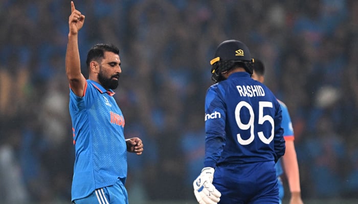 Indias Mohammed Shami celebrates after taking the wicket of Englands Adil Rashid (R) during the 2023 ICC Men´s Cricket World Cup one-day international (ODI) match at the Ekana Cricket Stadium in Lucknow on October 29, 2023. — AFP