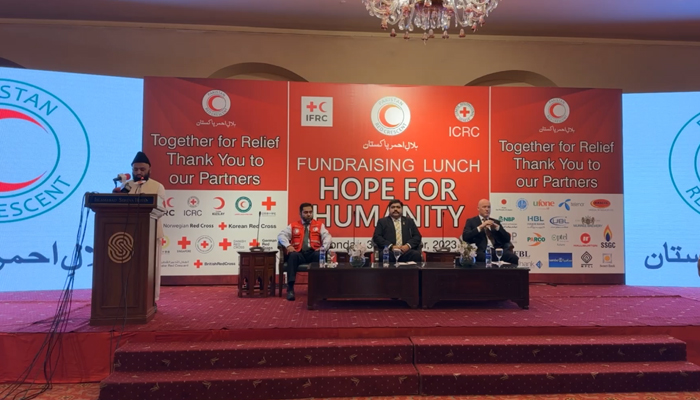 Officials and penalists of the Pakistan Red Crescent Society can be seen sitting on the stage in this still taken from a video released on October 30, 2023. — Facebook/Pakistan Red Crescent