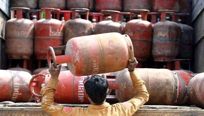 Th photo shows a worker placing the LPG cylinders atop a vehicle. AFP/File